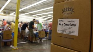 Outreach Program - 8 Des Moines Rotary Club Package Meals for Local Hunger
